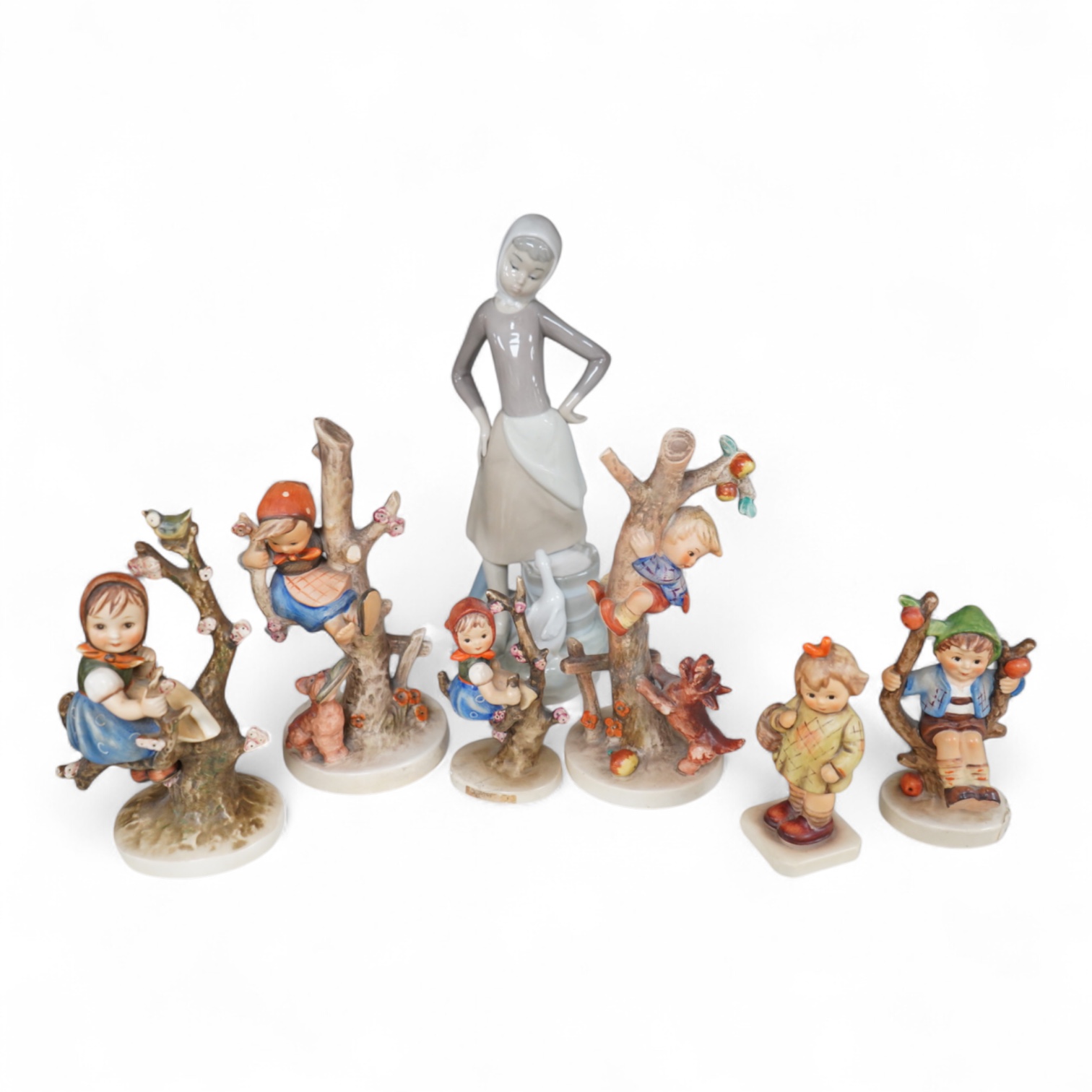 Six various Goebel figures and a Lladro figure, 24cm high